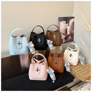 Collection of leather bucket bags in six colors featuring cute bear charms and metal locks