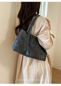 Rear view of minimalist dark grey retro tote bag showing stitching and strap detail