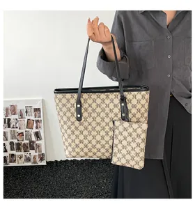 Detail shot of the vintage monogram tote bag set including a matching small zipper pouch