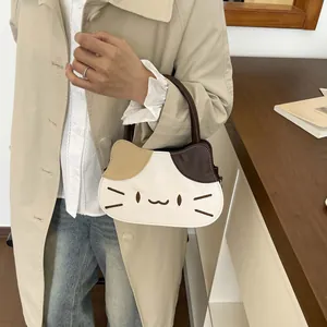 Three-tone cat-shaped handbag featuring embroidery details and top handle for women