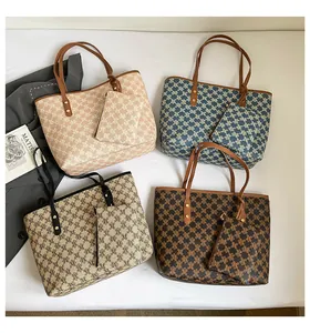 Top-down view of four vintage monogram tote bags in beige, brown, blue and khaki