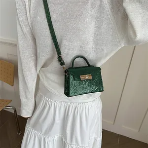 Fashionable dark green mini square handbag with croc pattern and metal lock closure