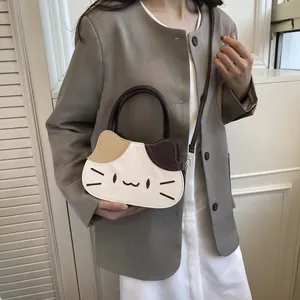 Three-color patchwork cat-shaped handbag with embroidery and adjustable shoulder strap