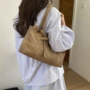 Minimalist brown vintage faux leather tote bag with stylish buckle and shoulder straps