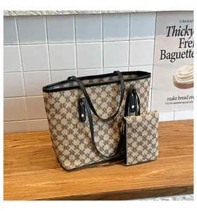 Detail of retro M-pattern tote bag set with contrasting trim and matching small pouch