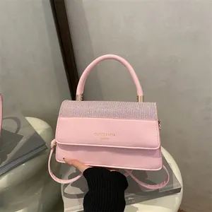 Pink leather square handbag with rhinestone-embellished flap and top handle for women