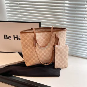 Retro tote bag set with monogram M print and contrast trim shown in a studio setting