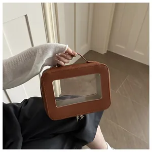 Detail of brown PVC storage bag showing lychee grain leather and transparent window