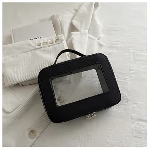 Detail of black organizer bag with clear PVC window and durable metal dual zippers