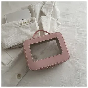 Pink Saffiano leather makeup bag with transparent window and double zip closure