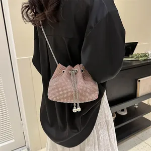 Sparkly pink rhinestone bucket bag with silver chain and pearl drawstrings for women