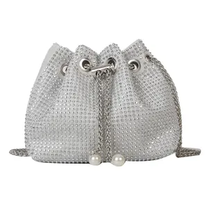 Luxury rhinestone bucket bag with silver metal chain strap and pearl drawstring tassels