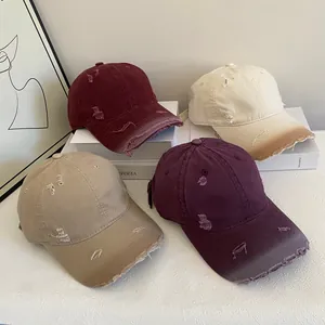 Distressed American vintage baseball caps in four colors with frayed brim details
