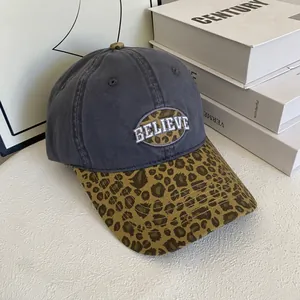 Unisex dark grey baseball cap with leopard print brim and Believe embroidery