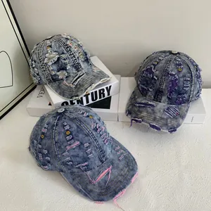 Vintage distressed denim baseball caps with ripped holes and colorful frayed edges