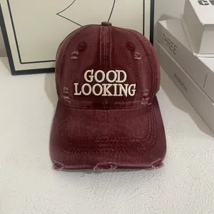 Detailed embroidery on vintage distressed baseball cap with Good Looking text