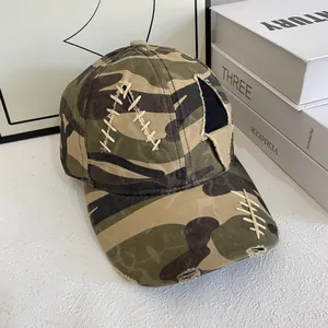 Distressed camouflage baseball cap with rivets and contrast stitching in street style