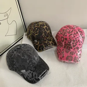 Distressed pink leopard print baseball caps with vintage American streetwear style