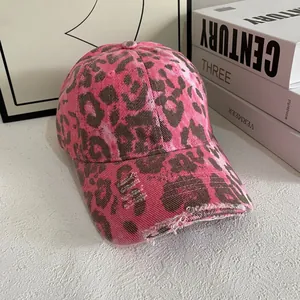 Vintage pink leopard print baseball cap with distressed details and y2k aesthetic style