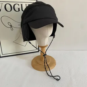 Detail of winter earflap cap with fleece texture and adjustable windproof strap
