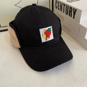 Fleece-lined navy baseball cap with ear flaps and strawberry embroidery for winter