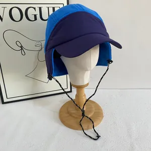 Detail of fleece trapper hat with ear flaps and adjustable patterned windproof cord