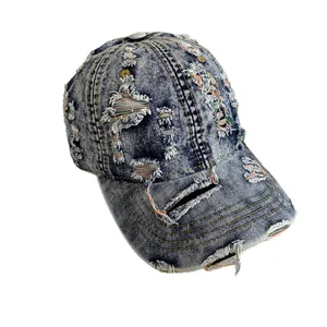 Distressed denim baseball cap with vintage frayed holes and colorful stitching details