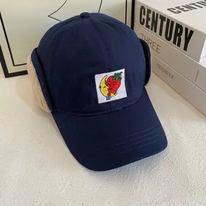 Detailed view of winter aviator hat with warm lamb wool lining and cartoon embroidery