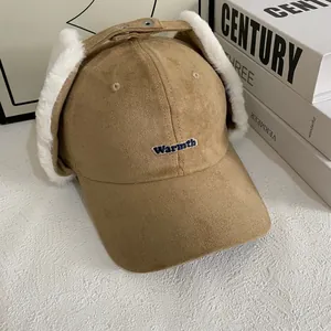 Detailed texture of khaki suede baseball cap with plush earflaps and Warmth embroidery