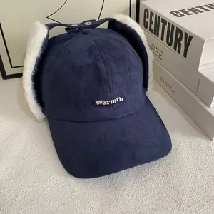 Detailed macro view of navy blue faux suede baseball hat with white plush earflaps and buckle