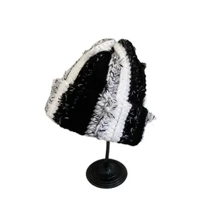 Handmade chunky knit beanie with black and white stripes for winter fashion warmth