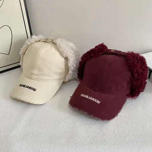 Faux fur lined earflap baseball cap with HANLIANXIU embroidery in beige and burgundy