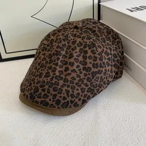 Close-up of vintage leopard print flat cap with premium brown suede brim detailing