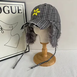 Plaid trapper baseball cap with faux fur ear flaps and yellow flower embroidery
