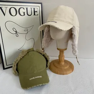 Plush-lined trapper hat in beige and army green with faux fur and retro embroidery