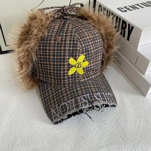Checkered winter trapper hat with faux fur trim and flower embroidery for warmth