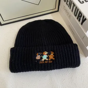 Close-up of three dogs embroidery and 'JOIN MY JOY' text on black ribbed knit beanie