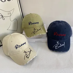 Vintage cotton baseball caps with Britney embroidery and distressed brim details