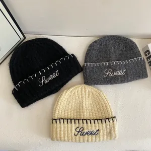 Winter knit beanies with Sweet embroidery and contrast stitching in black, grey, and beige