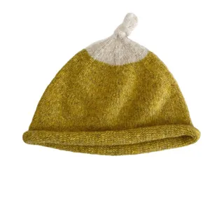 Cute contrast color knit beanie hat for women featuring a stylish rolled edge and top knot
