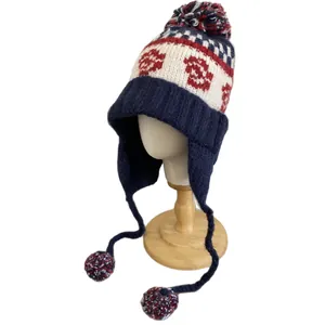 Ethnic Fair Isle knit trapper hat for women with navy pom-pom and ear flaps for winter