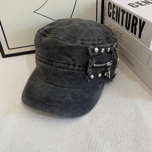 Detail view of washed cotton flat top hat with metallic rivets and side zipper accents