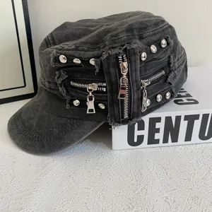 Detail of washed cotton cadet hat with metallic zipper and rivet accents on the side