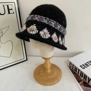 Detailed close-up of vintage jacquard knit bucket hat with colorful patterns on soft fabric