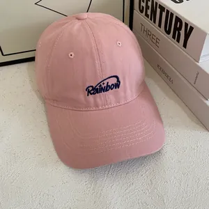 Pink cotton baseball cap with blue Rainbow embroidery and wide brim for outdoor sun protection