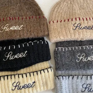 Women's knit beanie with Sweet embroidery and contrast stitching in six soft autumn colors