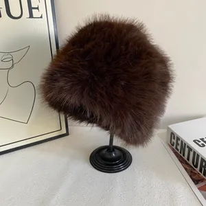 Detail view of the plush dark brown faux fur texture on a warm bucket hat for women