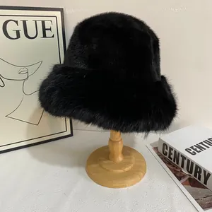 Detail shot of fluffy black faux fur bucket hat on a wooden stand in a cozy studio setting