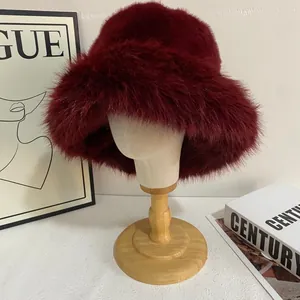 Macro shot of fluffy wine red faux fur texture on a winter fisherman hat for women