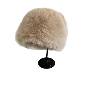 Plush faux fur winter bucket hat for women in beige with ear protection and warm fleece